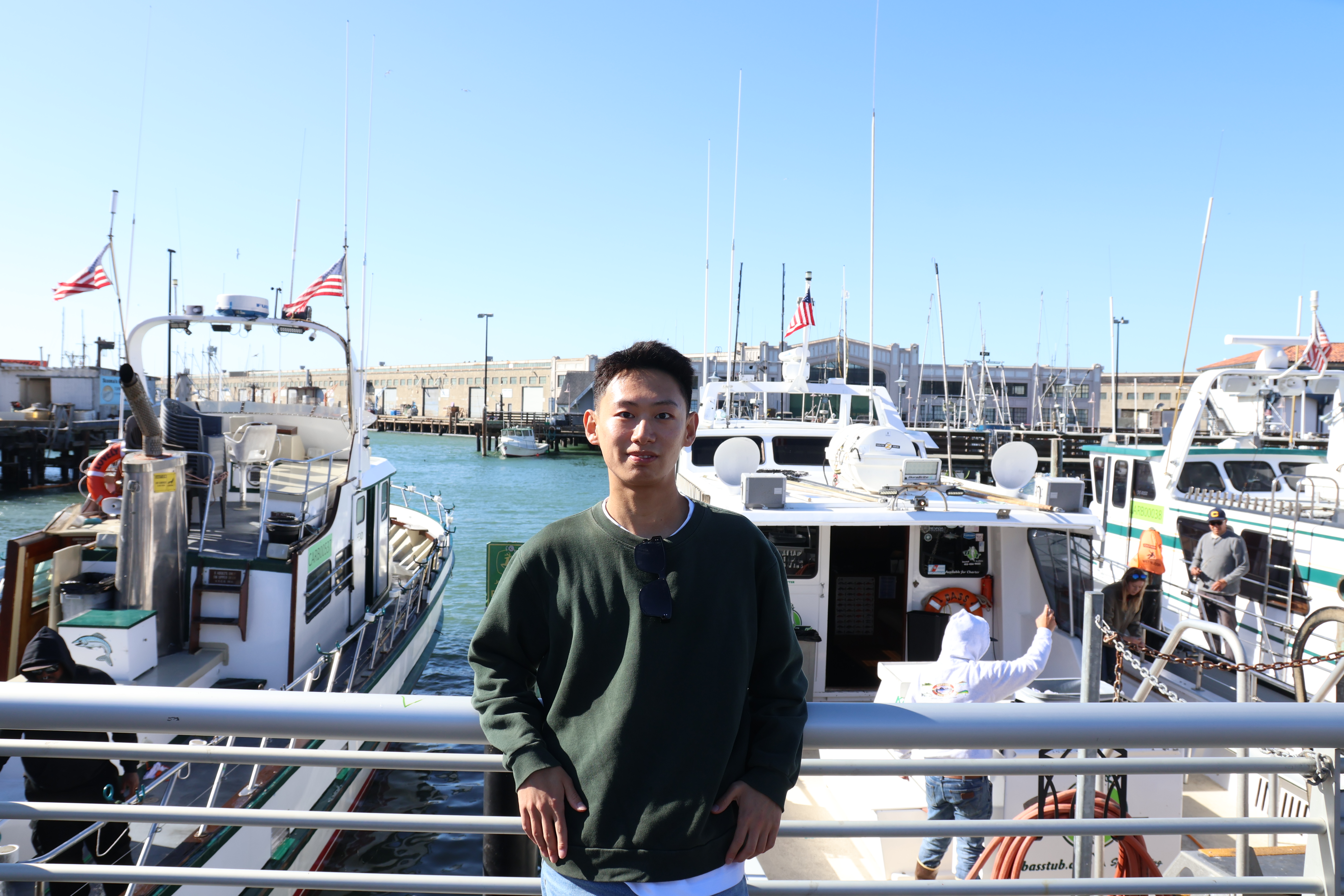 Runyu Lu standing at a harbor.